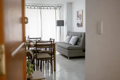 a living room with a table and a couch at Crisalida Apartamento in Sabaneta
