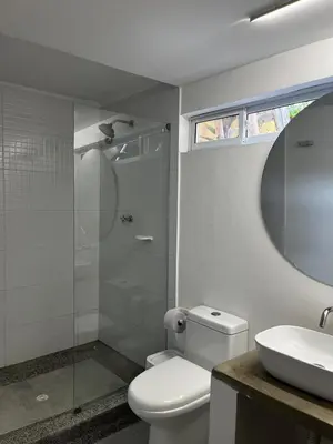 a bathroom with a toilet and a shower and a sink at Casa de la Cruz in Mariquita