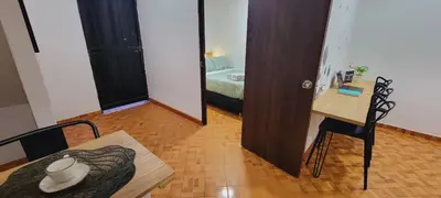 a room with a room with a bed and a table at Luxury Room San Nicolás Mall in Rionegro
