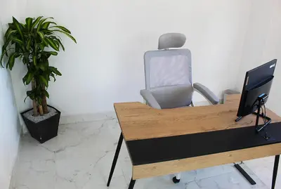 a desk with a computer and a chair in an office at Beverly Hills Mansion room only in Guarne