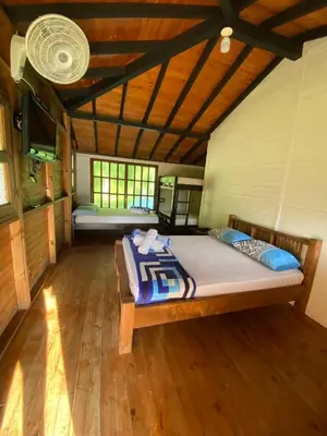 a bedroom with a large bed in a room at Ecohotel La Italia- Hotel Venecia, Antioquia in Venecia