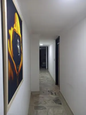 a hallway with a painting on the wall at apartamento 3 habitaciones cerca al parque del poblado in Medellín