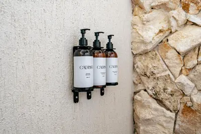 a bottle of wine hanging on a wall at La Gracia Hotel & Spa in San Jerónimo