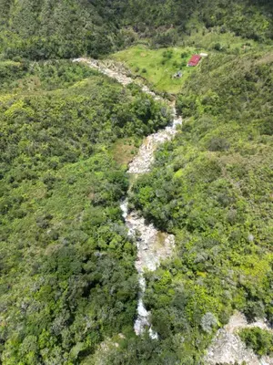 an aerial view of a river on a mountain at Reserva Natural Maimará in Alejandría