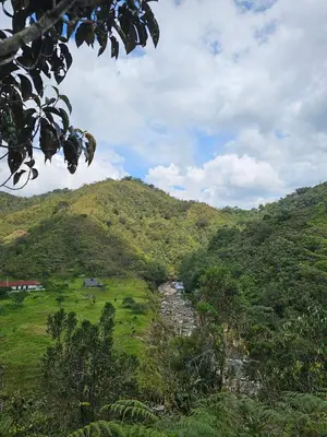 a view of a mountain with a river in a field at Reserva Natural Maimará in Alejandría
