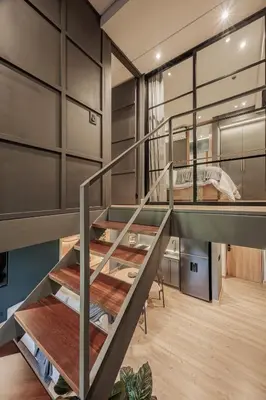 a room with a bunk bed and a staircase at H10 - Provenza in Medellín