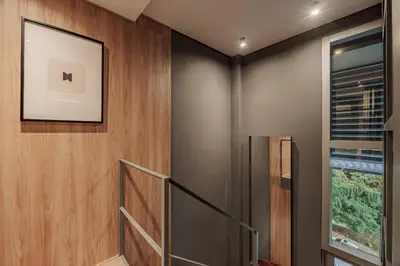 a staircase in a house with a picture on the wall at H10 - Provenza in Medellín