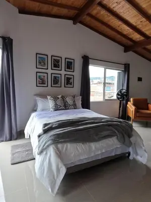 a bedroom with a large bed and a window at Hermoso Loft cerca al poblado y al metro in Medellín