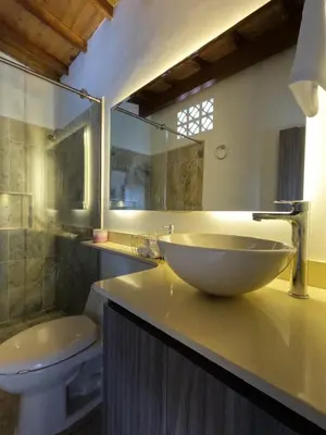 a bathroom with a bowl sink and a toilet at Hermoso Loft cerca al poblado y al metro in Medellín