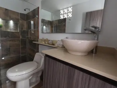 a bathroom with a sink and a toilet at Hermoso Loft cerca al poblado y al metro in Medellín