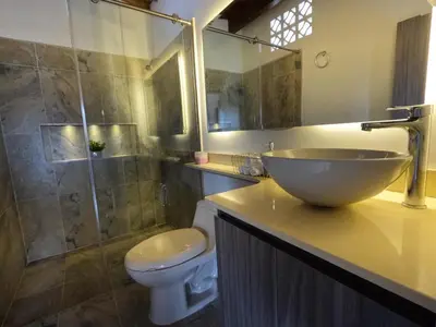 a bathroom with a sink and a toilet and a shower at Hermoso Loft cerca al poblado y al metro in Medellín