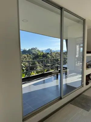 a view from the window of a house at Mountain Home Close to Guatape Pueblo With Jacuzzi in Guatapé