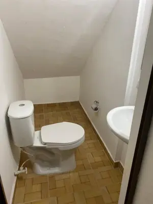 a bathroom with a toilet and a sink at Acogedor loft, para 4 huéspedes Medellín Antioquia in Medellín