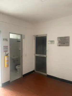 an empty bathroom with a toilet and a door at Apartment in Palmas - Poblado in Medellín