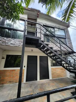 a house with a spiral staircase in front of it at Estupendo Loft en El Poblado in Medellín