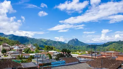 a view of a town with mountains in the background at Hotel Quinchia in Quinchía