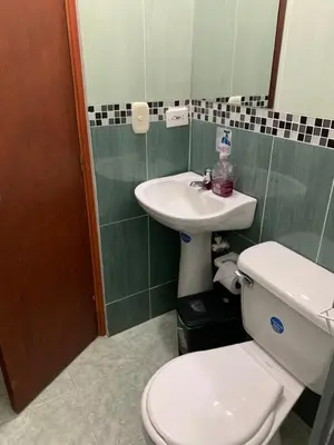 a bathroom with a toilet and a sink at Hotel Los Balcones in Doradal