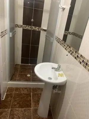 a bathroom with a sink and a shower at Hotel Los Balcones in Doradal