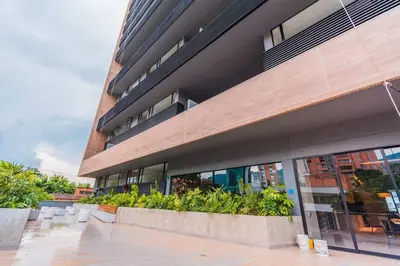 a building with plants in front of it at Hermosa Suite CoWork - Gym-WifI El Poblado in Medellín