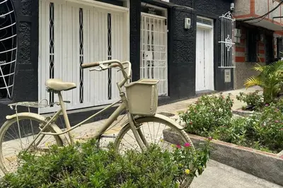 a bike parked in front of a building at Loft Zen en Envigado in Envigado