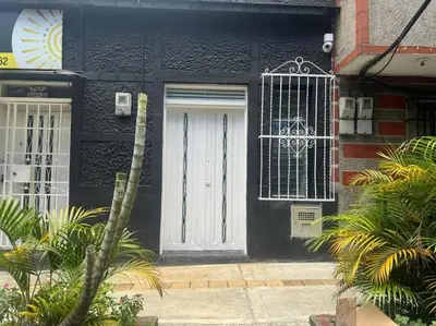 a black and white house with a white door at Loft Zen en Envigado in Envigado