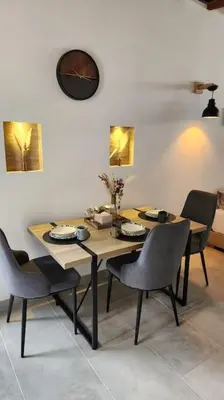 a dining table and chairs in a room with a table and chairsktop at Nuevo Loft en el Poblado in Medellín