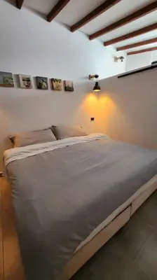 a bedroom with a white bed in a room at Nuevo Loft en el Poblado in Medellín