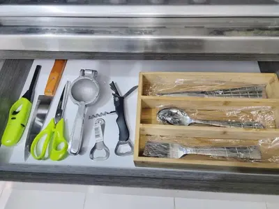 a drawer filled with kitchen utensils on a counter at Exclusivo apartamento en Estadio in Medellín