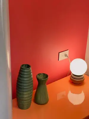 two vases and a lamp on a table at Son de la Loma Apartments in Envigado