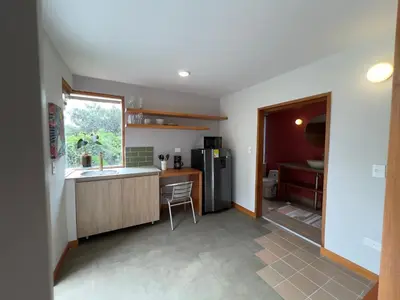 a kitchen with a sink and a refrigerator at Son de la Loma Apartments in Envigado