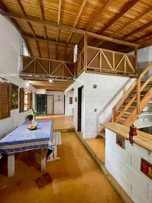 a large room with a table and a wooden ceiling at Hermosa casa finca en Marinilla in Marinilla
