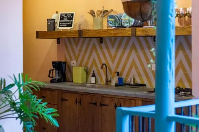 a kitchen with a sink and a counter top at Casa la batuta in Santa Fe de Antioquia