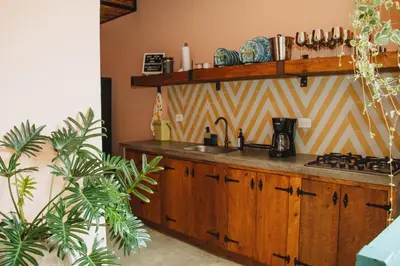 a kitchen with a sink and a counter top at Casa la batuta in Santa Fe de Antioquia