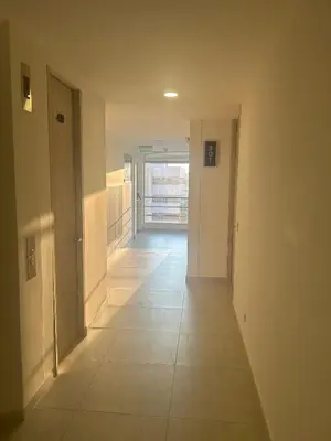 a hallway of a house with a tile floor at Amplio y Suntuoso - estrato 6 in Manizales