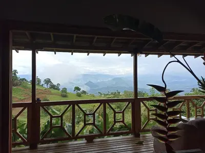 a window with a view of a mountain view at My Paradise Tamesis in Támesis