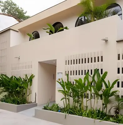 a building with plants in front of it at Casa Fiora Laureles in Medellín