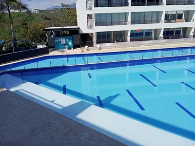 a large swimming pool in front of a building at Paraíso del sol in San Jerónimo