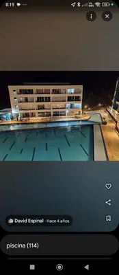a television with a picture of a swimming pool at Paraíso del sol in San Jerónimo