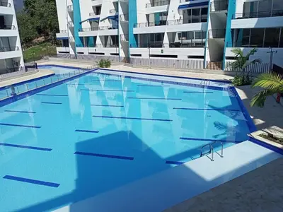 a large swimming pool in front of a building at Paraíso del sol in San Jerónimo