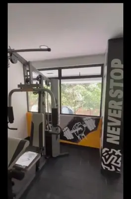 a room with a gym with a sign on the wall at Hotel Living 35 Suites Piso 8 Vip in Medellín