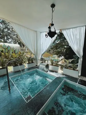 a swimming pool in the middle of a house at Dharma Hotel Boutique Spa in San Jerónimo