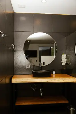 a bathroom with a sink and a mirror at Dharma Hotel Boutique Spa in San Jerónimo