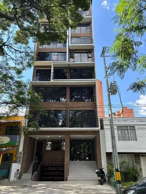 a tall building with stairs in front of it at Hotel ECO 44 in Medellín