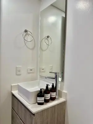 a bathroom with a sink and a mirror at Hotel ECO 44 in Medellín