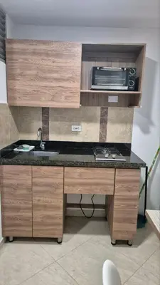 a kitchen with a sink and a microwave at ApartaLoft 13, NevadaLofts Sabaneta in Sabaneta