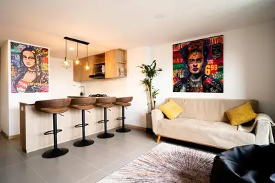 a living room with a couch and a bar at Amazing cozy & new flat 3 bedrooms in Medellin best location in Medellín