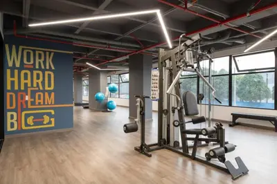 a gym with a treadmill in a room at Amazing cozy & new flat 3 bedrooms in Medellin best location in Medellín