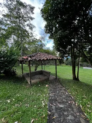 a small structure in the grass in a park at Yarumito Finca Hotel l Cabaña Girasol in Barbosa