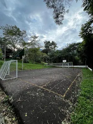 an empty soccer field with a goal at Yarumito Finca Hotel l Cabaña Girasol in Barbosa
