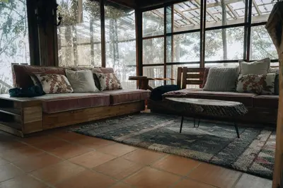 a living room with a couch and a table at Refugio Santa Elena in Santa Elena